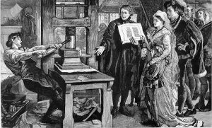 This is a black and white wood cut image of a worker manually operating a printing press and showing it to a fancily-dressed royal family circa 1877.